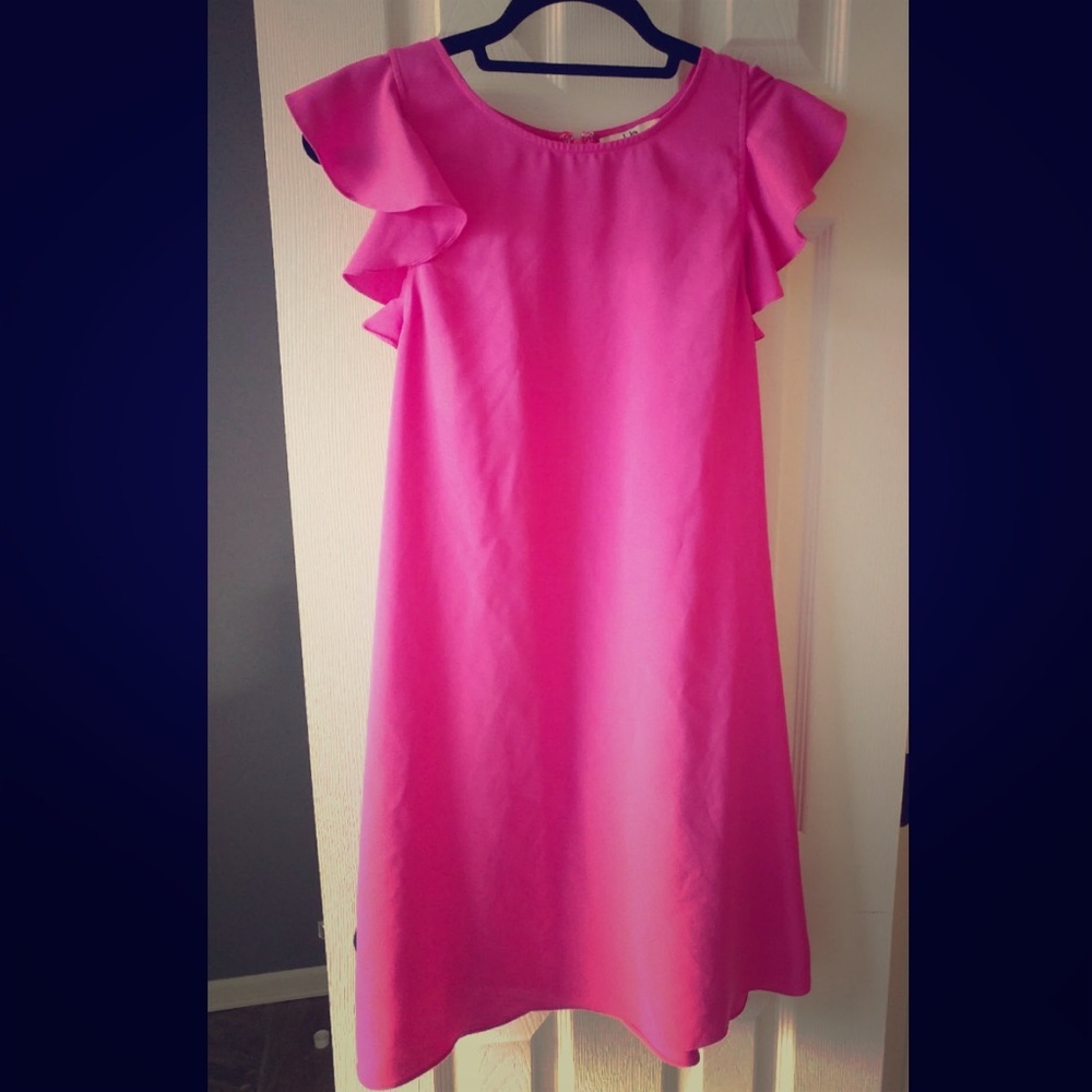 Bright pink dress with ruffled shoulder